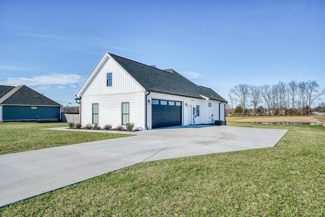 view of property exterior featuring a garage and a lawn