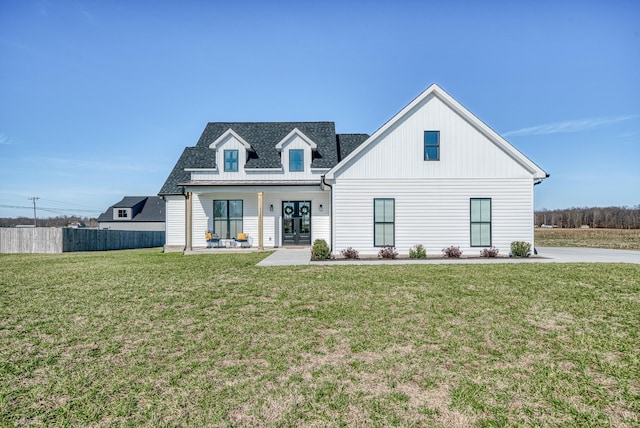 view of front facade featuring a front lawn and a porch