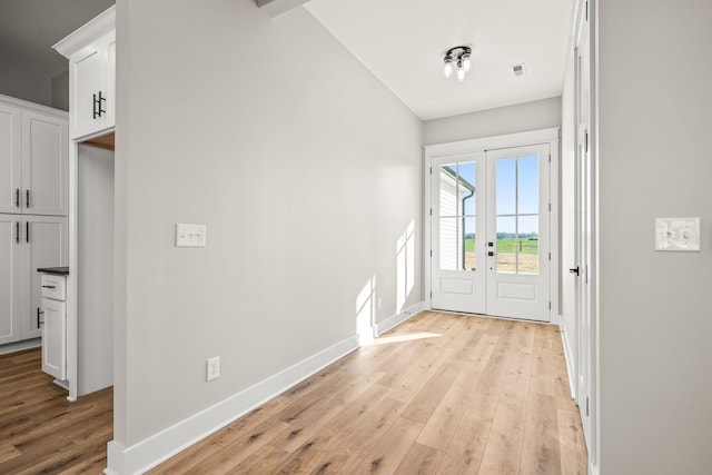 interior space featuring light hardwood / wood-style flooring and french doors