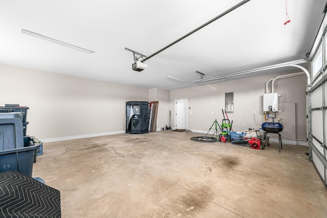 garage featuring water heater and a garage door opener