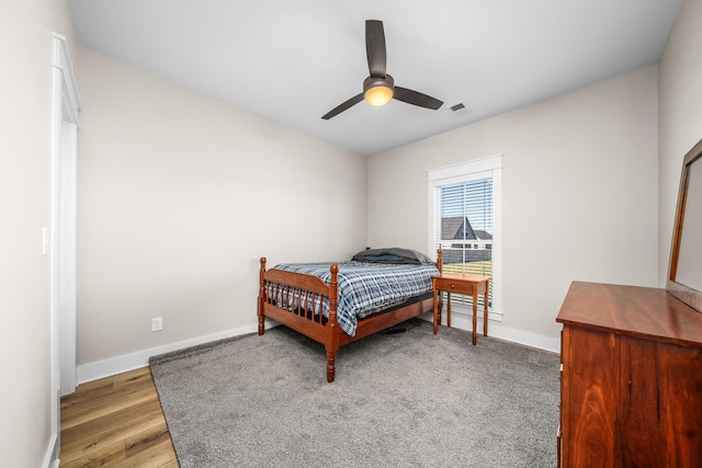 bedroom featuring light hardwood / wood-style floors and ceiling fan