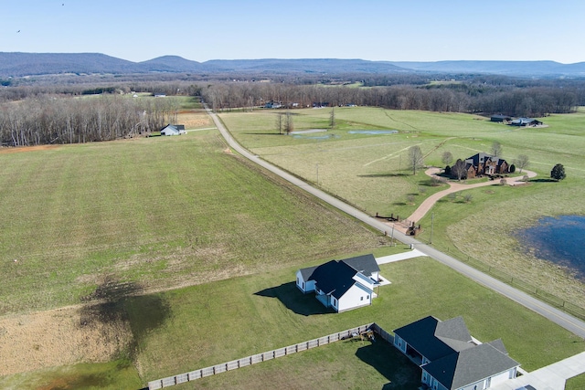 aerial view featuring a rural view and a mountain view