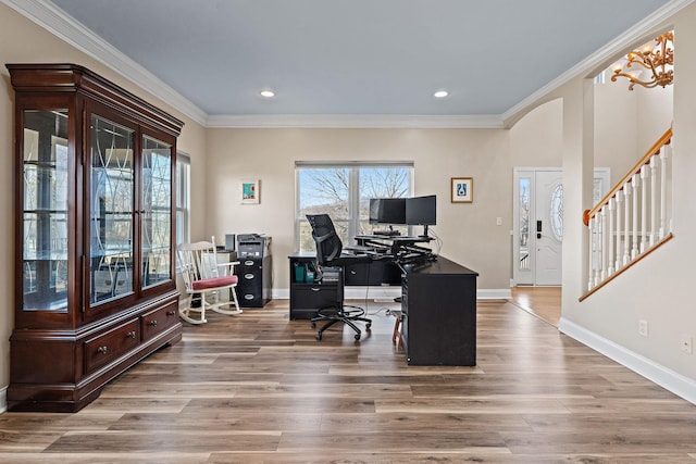 home office featuring hardwood / wood-style flooring, crown molding, and an inviting chandelier