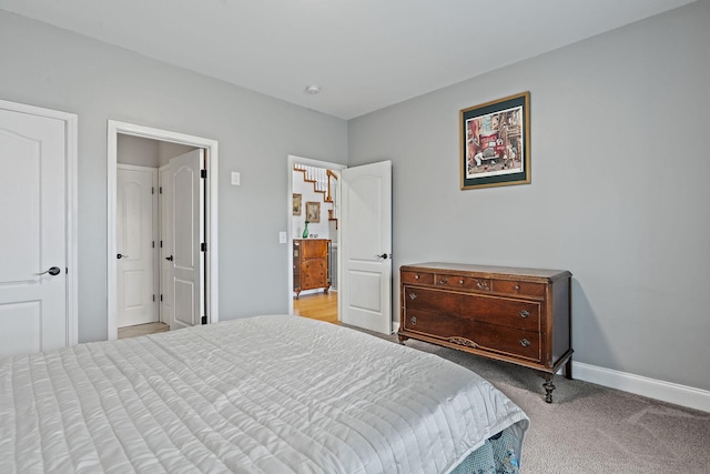 bedroom featuring light colored carpet