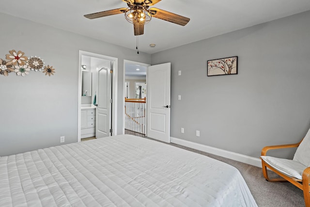 carpeted bedroom featuring ceiling fan and ensuite bath