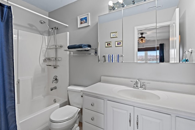 full bathroom featuring shower / bathtub combination with curtain, vanity, and toilet