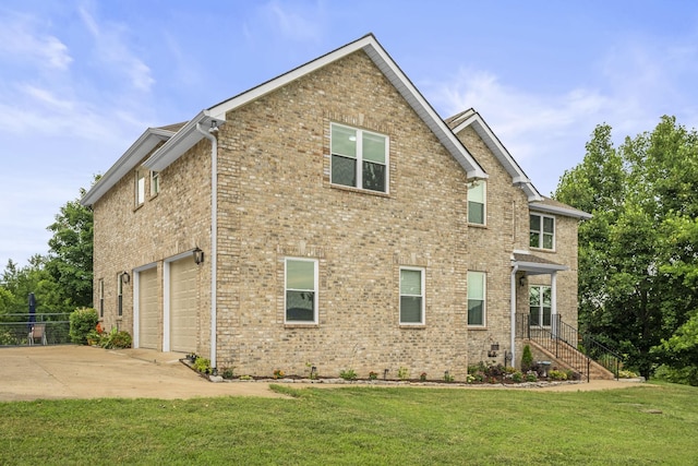 view of property exterior featuring a garage and a yard