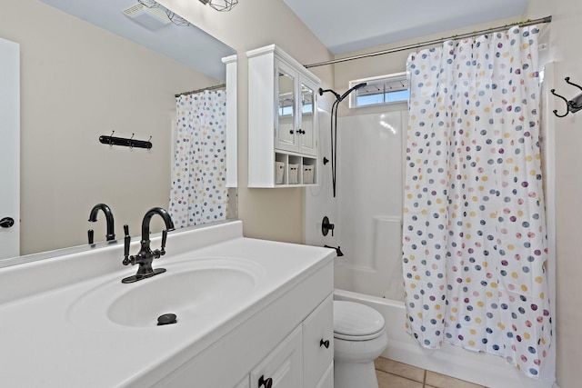 full bathroom with vanity, toilet, tile patterned floors, and shower / bath combo with shower curtain