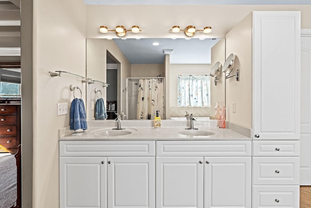 bathroom featuring a shower with shower curtain and vanity