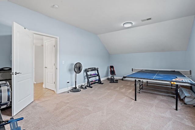 rec room featuring vaulted ceiling and light colored carpet