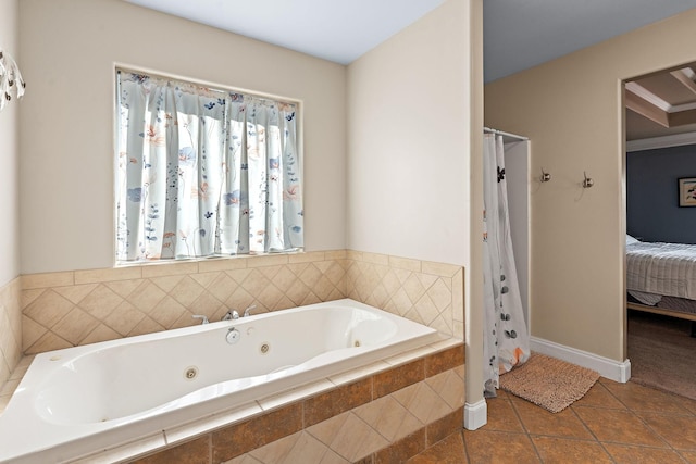 bathroom featuring tile patterned floors and a relaxing tiled tub