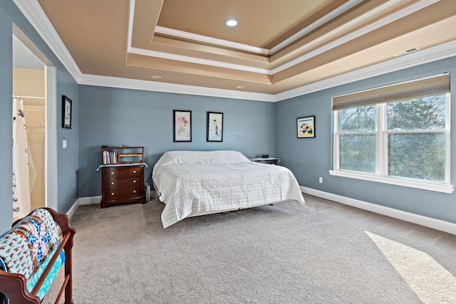 bedroom featuring a tray ceiling, carpet floors, and crown molding