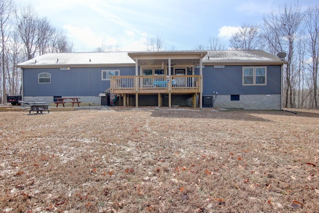 back of property featuring a deck, cooling unit, and ceiling fan