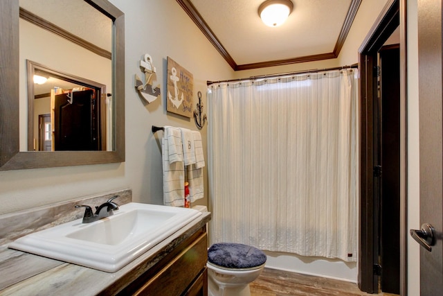 full bathroom featuring shower / tub combo with curtain, ornamental molding, vanity, and toilet