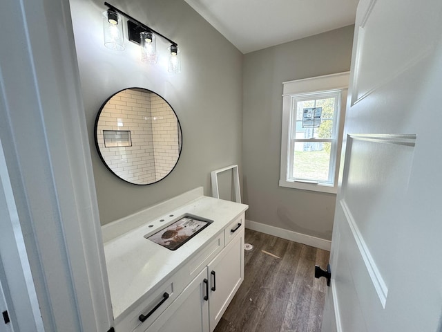 bathroom with wood-type flooring and vanity