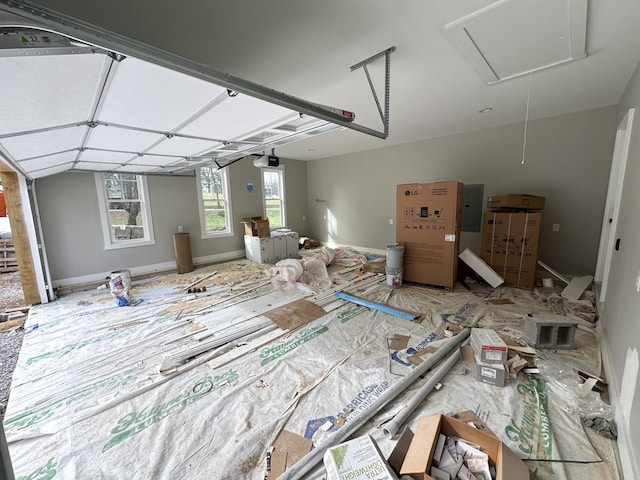 interior space featuring electric panel and a garage door opener