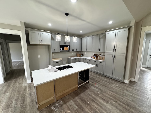 kitchen with gray cabinetry and a center island