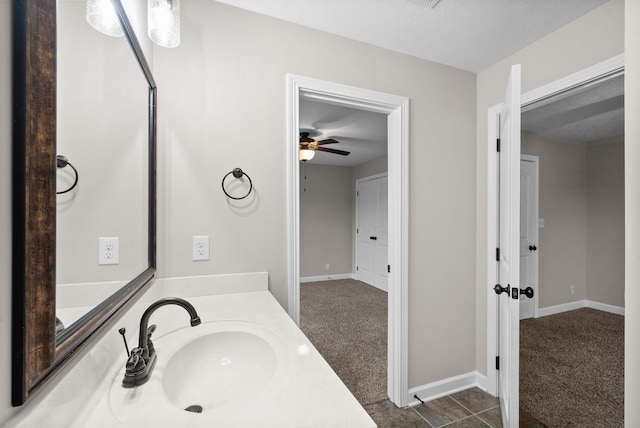 bathroom featuring vanity and a textured ceiling