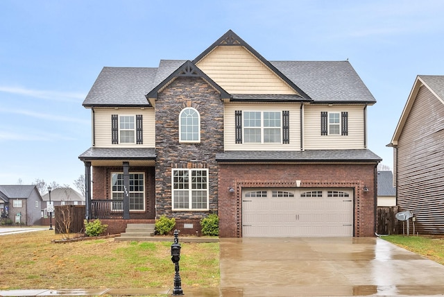 craftsman-style home featuring a front yard and a garage