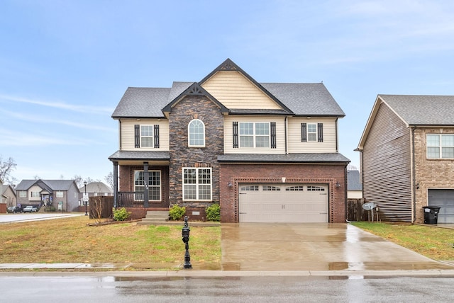 craftsman-style home featuring a garage, a front lawn, and a porch