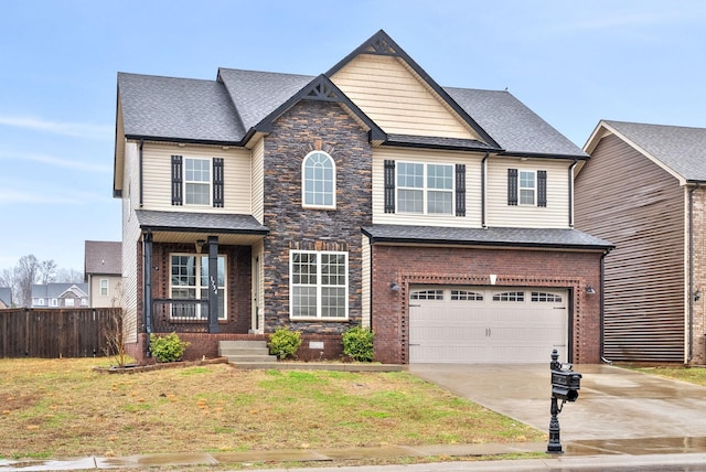 craftsman-style house with a front lawn and a garage