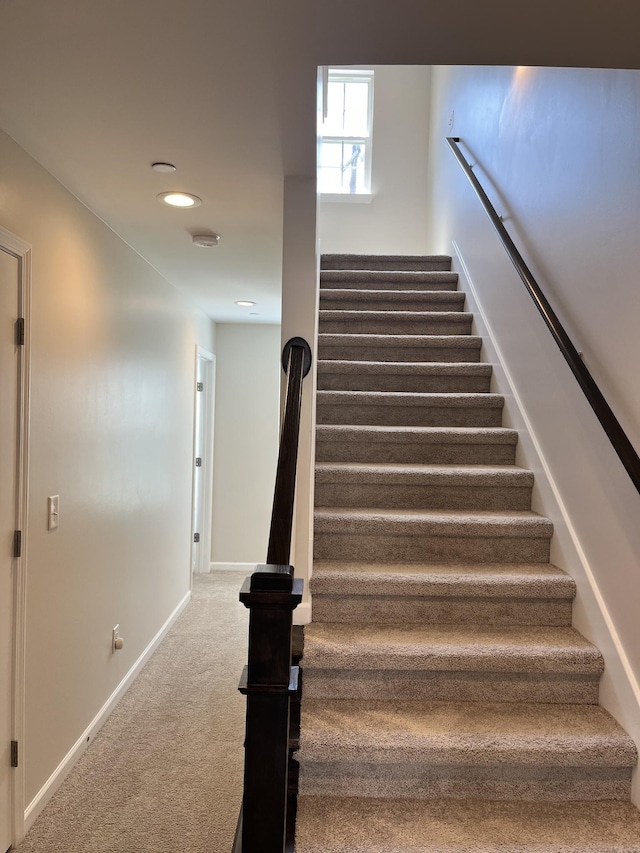 staircase with carpet