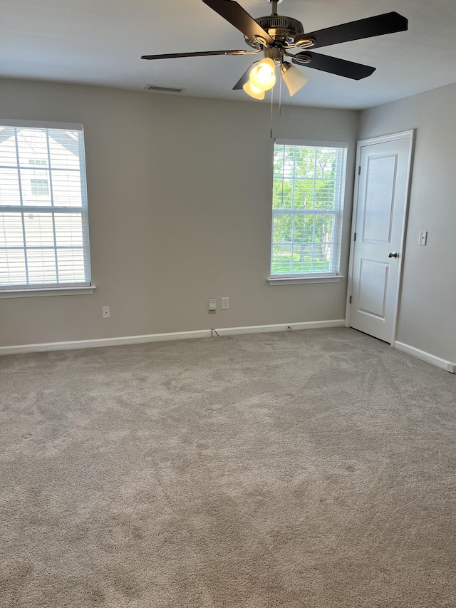 empty room with light carpet and ceiling fan