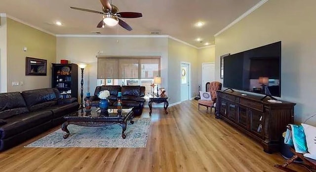 living room with ceiling fan, ornamental molding, and light hardwood / wood-style floors