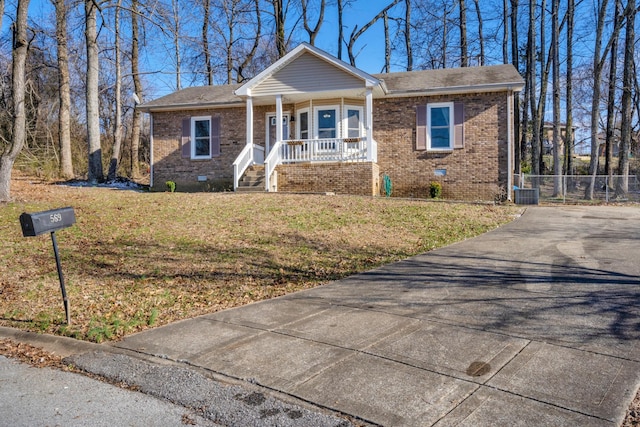 view of front of house with a porch and a front yard