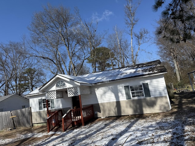 view of front of home with fence