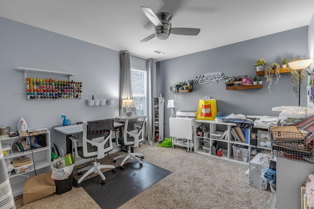 carpeted office with ceiling fan