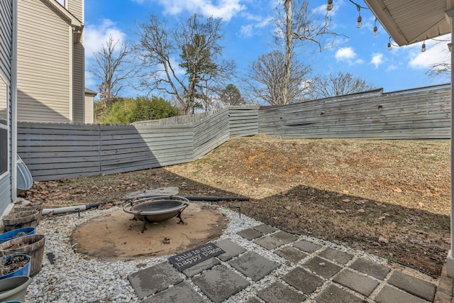 view of yard featuring a patio area and an outdoor fire pit