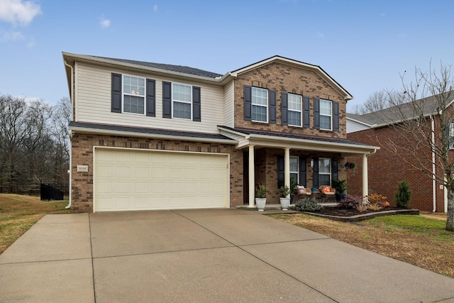 view of front of house with a garage and a porch