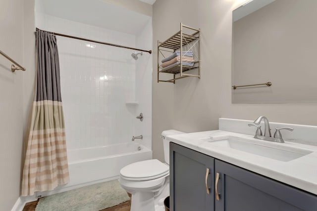 full bathroom with toilet, shower / tub combo with curtain, and vanity