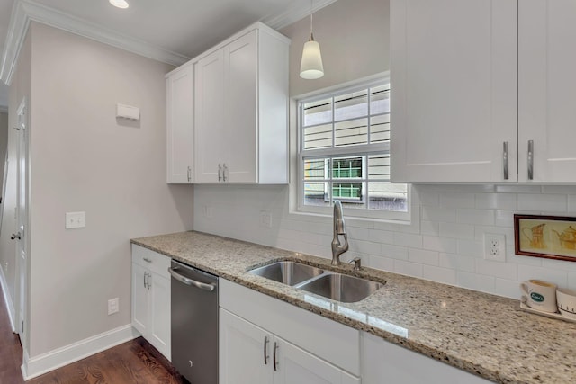 kitchen with hanging light fixtures, light stone counters, stainless steel dishwasher, sink, and white cabinetry