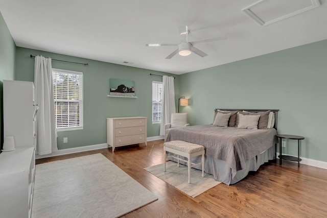 bedroom featuring ceiling fan and hardwood / wood-style floors