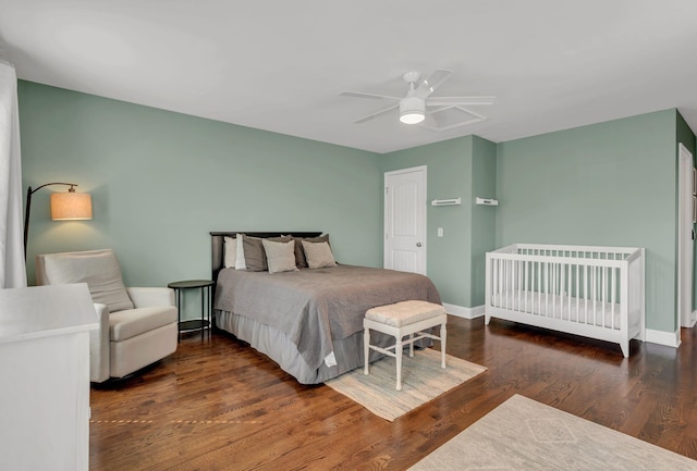 bedroom with dark hardwood / wood-style floors and ceiling fan