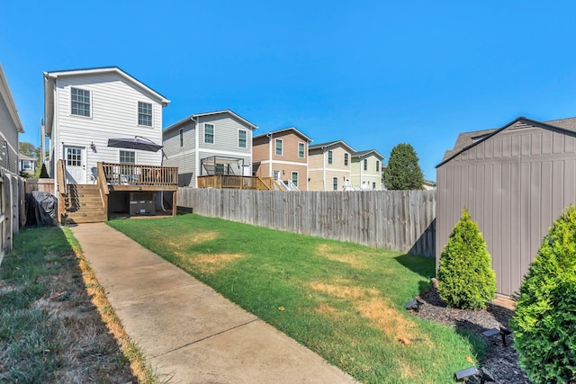 view of yard featuring central AC and a wooden deck