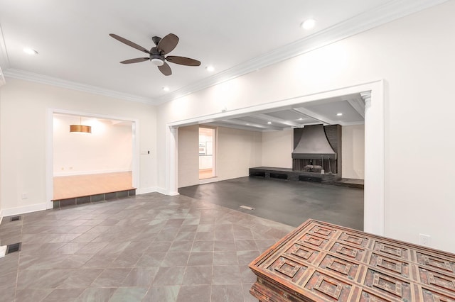 unfurnished living room with ceiling fan and crown molding