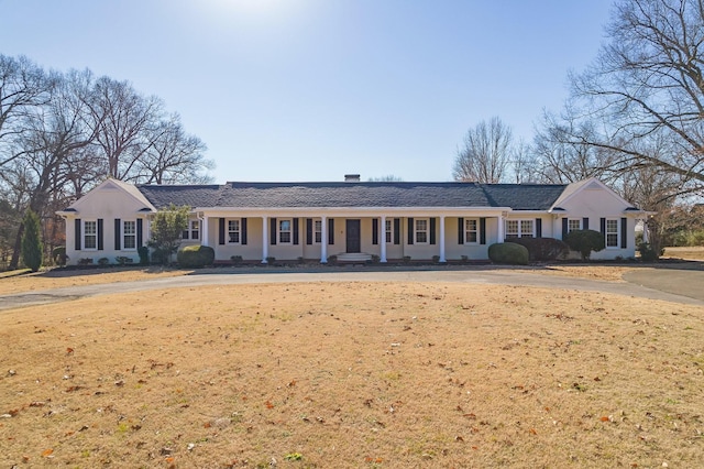 ranch-style house with a front yard