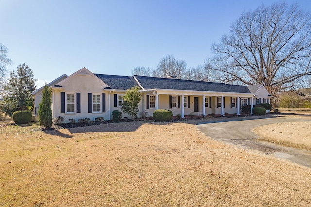 ranch-style home with covered porch