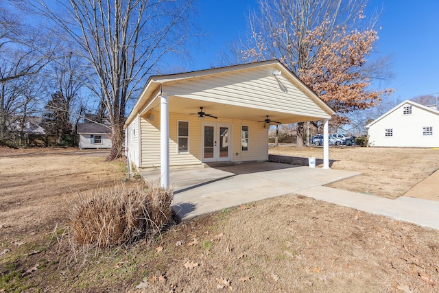 view of front of home with french doors, a patio, and ceiling fan