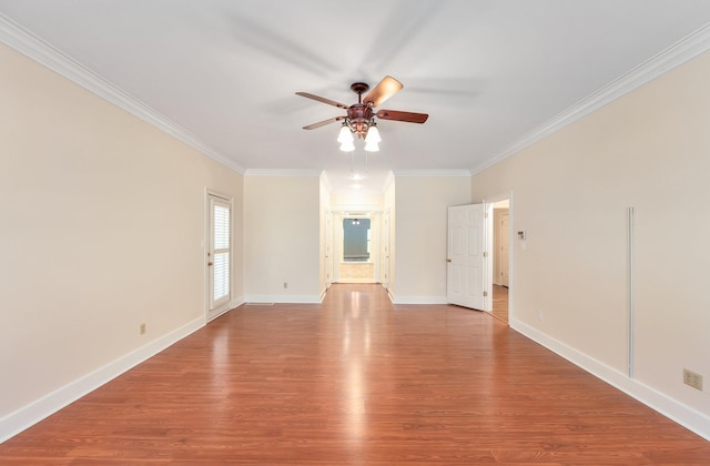 empty room with ceiling fan, light wood-type flooring, and crown molding