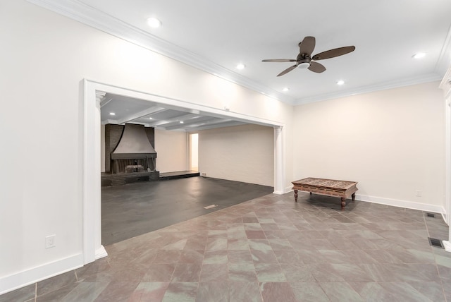 basement with ceiling fan and crown molding