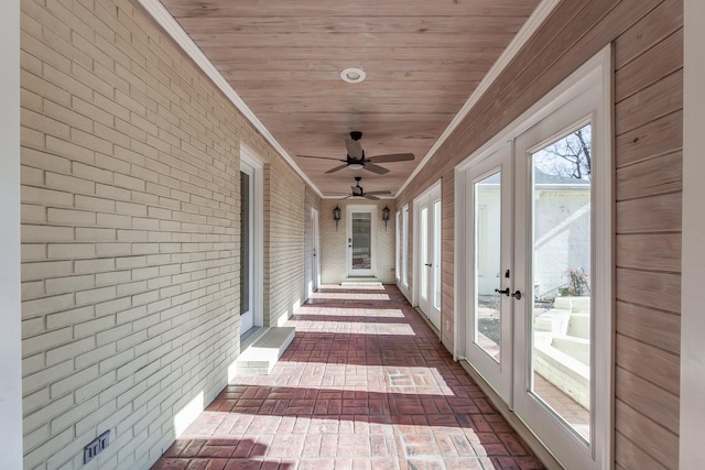 unfurnished sunroom featuring french doors and wooden ceiling