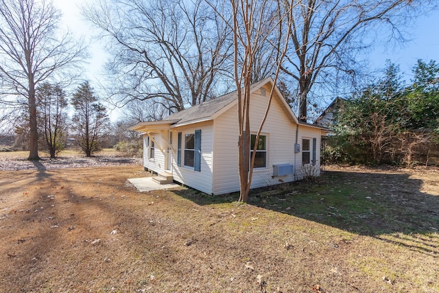 view of home's exterior featuring a yard