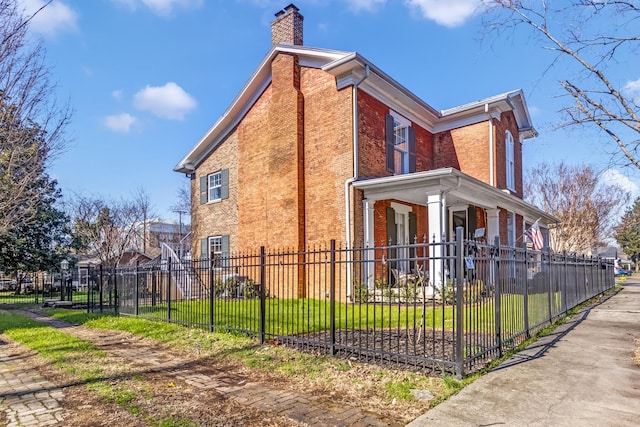 view of side of home with a yard