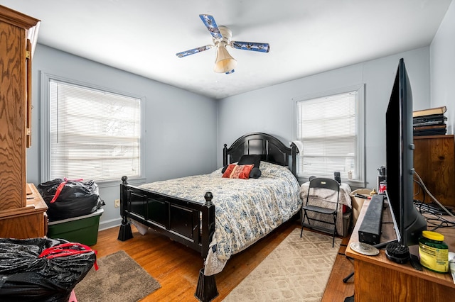 bedroom with ceiling fan and light wood-type flooring