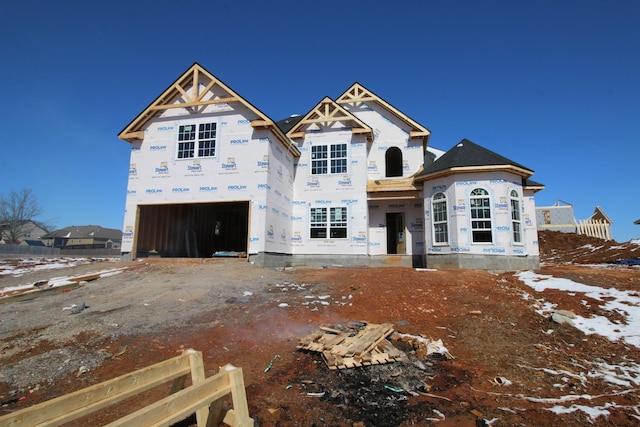 property in mid-construction featuring fence and an attached garage