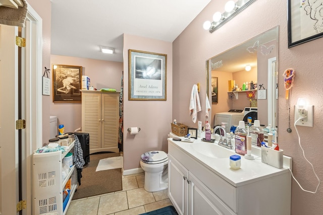 126 Andrea Ln, Monterey, TN 38574 - bathroom featuring toilet, vanity, independent washer and dryer, baseboards, and tile patterned floors